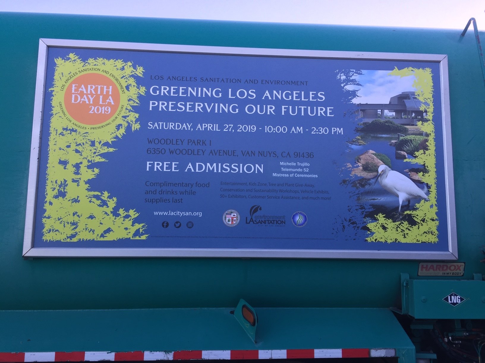 Event promotion panel for Earth Day LA displayed in a Roadway frame on a sanitation vehicle